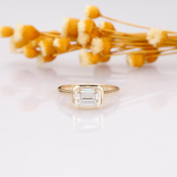 Elegant Yellow Gold Emerald Cut Bezel Setting Engagement Ring in Sterling Silver