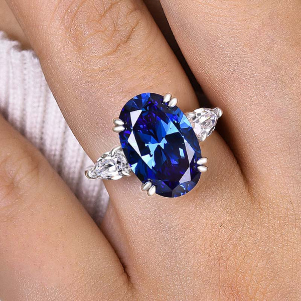 Elegant Blue Sapphire Three Stone Oval Cut Engagement Ring in Sterling Silver