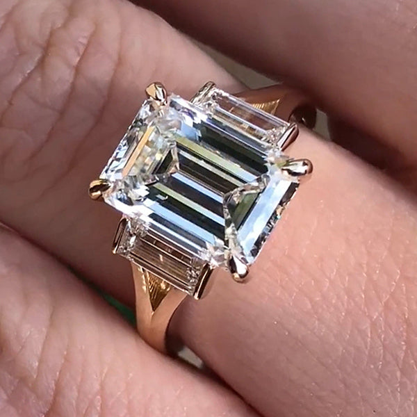 Elegant Split Shank Three Stone Emerald Cut Engagement Ring