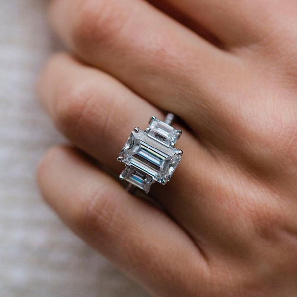 Exquisite Emerald Cut Three Stone Engagement Ring in White Gold