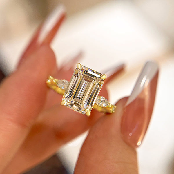 Elegance Yellow Gold Three Stone Emerald Cut Women's Engagement Ring in Sterling Silver
